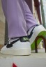 Nike Sportswear NIKE BLAZER LOW  Sneaker low white/aquamarine-lime glow-off noir-sail NIKE BLAZER LOW — Низкие кроссовки женские белый/аквамариново-лаймовый светящийся нуар-парус
