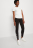 Tommy Hilfiger SLIM ROPE  Leggings Trousers black SLIM ROPE Леггинсы Брюки черный