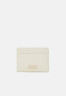 Tommy Hilfiger CASUAL CHIC HOLDER Wallet sugarcane CASUAL CHIC HOLDER Бумажник сахарный тростник