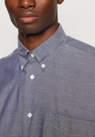 Tommy Hilfiger TOMMY HILFIGER X SHAWN MENDES OXFORD ARCHIVE SHIRT UNISEX Shirt blue coast TOMMY HILFIGER X SHAWN MENDES OXFORD ARCHIVE РУБАШКА УНИСЕКС Рубашка голубое побережье