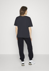 Tommy Hilfiger RELAXED GRAPHIC PANT Tracksuit bottoms desert sky RELAXED GRAPHIC PANT Спортивные штаны небо пустыни