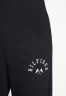Tommy Hilfiger RELAXED GRAPHIC PANT Tracksuit bottoms desert sky RELAXED GRAPHIC PANT Спортивные штаны небо пустыни