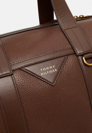 Tommy Hilfiger PREMIUM LEATHER DUFFLE UNISEX Weekend bag dark chestnut КОЖАНАЯ СУМКА PREMIUM UNISEX Сумка выходного дня темно-каштановый