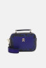 Tommy Hilfiger ICONIC TOMMY TRUNK MONOGRAM Across body bag space blue mix ICONIC TOMMY TRUNK MONOGRAM Сумка через плечо космический синий микс