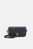 Tommy Hilfiger EMBLEM FLAP CROSSOVER Across body bag space blue EMBLEM FLAP CROSSOVER Сумка через плечо космический синий