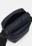 Tommy Hilfiger SKYLINE MINI REPORTER UNISEX Across body bag space blue SKYLINE MINI REPORTER UNISEX Сумка через плечо космический синий