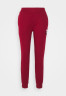Tommy Hilfiger TAPERED MONOGRAM SWEATPANTS Tracksuit bottoms rouge СПОРТИВНЫЕ БРЮКИ TAPERED MONOGRAM Спортивные штаны румяна