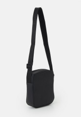 Tommy Hilfiger ESSENTIAL MINI REPORTER UNISEX Across body bag black ESSENTIAL MINI REPORTER UNISEX Сумка через плечо черный