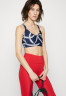 Tommy Hilfiger LOW ROPE STRAPPY BRA Light support sports bra carbon navy LOW ROPE STRAPPY BRA Спортивный бюстгальтер с легкой поддержкой углеродный флот