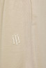 Tommy Hilfiger RELAXED INTERLOCKPANT Tracksuit bottoms beige RELAXED INTERLOCKPANT Спортивные штаны бежевый