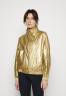 Tommy Hilfiger RELAXED SAILING JACKET Training jacket gold-coloured RELAXED SAILING JACKET Тренировочная куртка золотого цвета