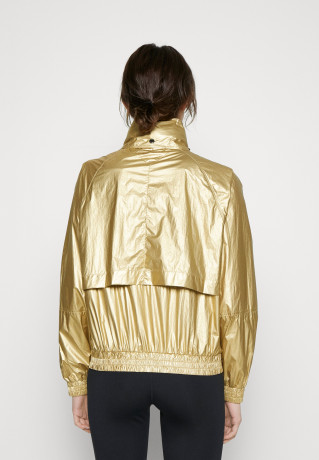 Tommy Hilfiger RELAXED SAILING JACKET Training jacket gold-coloured RELAXED SAILING JACKET Тренировочная куртка золотого цвета