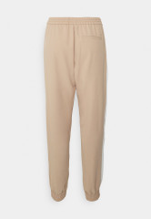 Tommy Hilfiger FLUID JOGGER PANT Tracksuit bottoms beige / ecru  FLUID JOGGER PANT Спортивные штаны бежевый / экрю