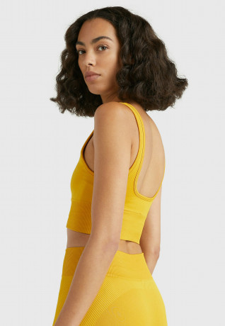 Tommy Hilfiger MID INTENSITY SHINY SEAMLESS  Sports bra countryside yellow MID INTENSITY SHINY SEAMLESS Спортивный бюстгальтер сельский желтый