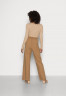 Tommy Hilfiger FLEX WIDE LEG PANT Tracksuit bottoms countryside khaki FLEX WIDE LEG PANT Брюки от спортивного костюма загородный хаки