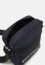 Tommy Hilfiger HILFIGER MINI REPORTER Across body bag space blue HILFIGER MINI REPORTER Сумка через плечо космический синий