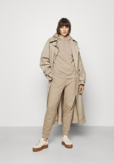 Tommy Hilfiger REGULAR SCRIPT  Tracksuit bottoms beige ОБЫЧНЫЙ СЦЕНАРИЙ Низ спортивного костюма бежевый