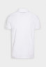 Tommy Hilfiger SHADOW UNISEX Polo shirt optic white SHADOW UNISEX Рубашка поло оптический белый