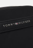 Tommy Hilfiger CENTRAL REPREVE MINI REPORTER UNISEX Across body bag black CENTRAL REPREVE MINI REPORTER UNISEX Сумка через плечо черный