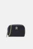 Tommy Hilfiger FEMININE CROSSOVER Across body bag space blue FEMININE CROSSOVER Сумка через плечо космический синий