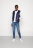 Tommy Hilfiger SPORTY SORONA SIDE ZIP VEST Waistcoat desert sky ЖИЛЕТ SPORTY SORONA SIDE ZIP VEST Жилет небо пустыни