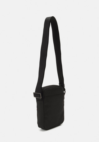 Tommy Hilfiger 1985 MINI REPORTER UNISEX Across body bag black 1985 MINI REPORTER UNISEX — Сумка через плечо черный