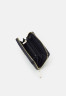 Tommy Hilfiger ICONIC MED MONO Wallet space blue ICONIC MED MONO Бумажник космический синий