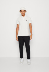 Tommy Hilfiger TOMMY HILFIGER X SHAWN MENDES POLO UNISEX Polo shirt weathered white TOMMY HILFIGER X SHAWN MENDES POLO UNISEX Рубашка поло выветрившийся белый