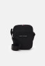 Tommy Hilfiger ESSENTIAL MINI RPORTER UNISEX Across body bag black ESSENTIAL MINI RPORTER UNISEX Сумка через плечо черный
